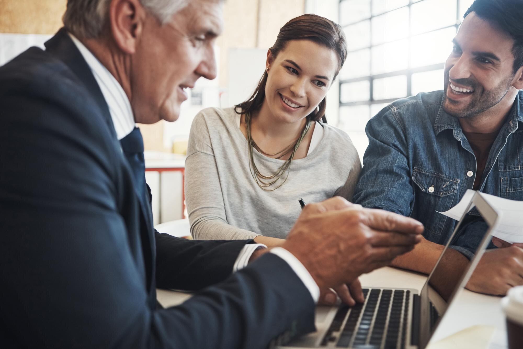 discussion couple financial advisor with screen consulting insurance plan investment office advice l